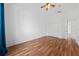 Bedroom featuring hardwood floors and a ceiling fan at 1338 Lake Biscayne Way, Orlando, FL 32824