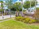 Welcoming community entrance with lush landscaping, offering a secure and picturesque entry at 1338 Lake Biscayne Way, Orlando, FL 32824