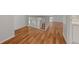 Bright hallway with hardwood flooring leading to the second story at 1338 Lake Biscayne Way, Orlando, FL 32824