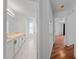 Bright hallway leading to bathroom and bedroom at 1338 Lake Biscayne Way, Orlando, FL 32824