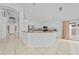 Open kitchen with granite countertops, white cabinets, and recessed lighting at 1338 Lake Biscayne Way, Orlando, FL 32824