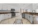 Bright kitchen with white cabinetry, stainless steel appliances, and stone countertops at 1338 Lake Biscayne Way, Orlando, FL 32824