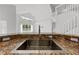 Close-up of a stainless steel kitchen sink set in granite countertops at 1338 Lake Biscayne Way, Orlando, FL 32824