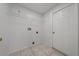 Laundry room with tile floors and storage at 1338 Lake Biscayne Way, Orlando, FL 32824