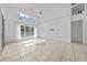 Open living room with high ceilings, tile floors, and large windows at 1338 Lake Biscayne Way, Orlando, FL 32824