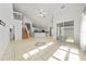 Open-concept living space features tile floors and seamless flow to the kitchen at 1338 Lake Biscayne Way, Orlando, FL 32824