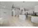 Open-concept layout with tile floors connecting the living space to the modern kitchen at 1338 Lake Biscayne Way, Orlando, FL 32824