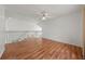 Upstairs loft with hardwood flooring and white stair railing at 1338 Lake Biscayne Way, Orlando, FL 32824
