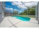 Inviting screened pool provides outdoor enjoyment while ensuring safety and protection from insects at 1338 Lake Biscayne Way, Orlando, FL 32824