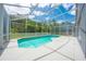 Screened in pool with blue water offers a refreshing outdoor space at 1338 Lake Biscayne Way, Orlando, FL 32824