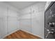 Walk-in closet with wood floors, wire shelving and security safe at 1338 Lake Biscayne Way, Orlando, FL 32824
