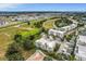 An aerial view of a modern condo community with manicured landscaping near a bustling city at 1501 Northern Harrier Way # 101, Kissimmee, FL 34747