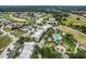 An aerial view of a condo community with a swimming pool, golf course, and easy highway access at 1501 Northern Harrier Way # 101, Kissimmee, FL 34747