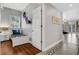 Hallway with tile and wood floors leads to living area and a bedroom with Star Wars themed decor at 1501 Northern Harrier Way # 101, Kissimmee, FL 34747
