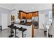 A modern kitchen with stainless steel appliances, a breakfast bar, and sleek countertops at 1501 Northern Harrier Way # 101, Kissimmee, FL 34747