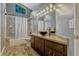 Bathroom featuring single vanity, tub/shower combo and neutral finishes at 154 Academy Oaks Pl, Altamonte Springs, FL 32714