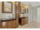 Bathroom featuring dual sinks, wood cabinets and tile floors at 154 Academy Oaks Pl, Altamonte Springs, FL 32714