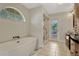 Bathroom featuring free-standing tub, glass shower and modern vanity at 154 Academy Oaks Pl, Altamonte Springs, FL 32714