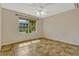 Cozy bedroom featuring neutral paint, tile floors and window overlooking the front yard at 154 Academy Oaks Pl, Altamonte Springs, FL 32714