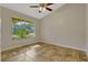 Cozy bedroom featuring neutral paint, tile floors and window overlooking the front yard at 154 Academy Oaks Pl, Altamonte Springs, FL 32714