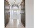 Inviting foyer with tile flooring, barn doors, decorative lighting, and frosted glass front door at 154 Academy Oaks Pl, Altamonte Springs, FL 32714