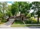 Charming home with lush landscaping, mature trees, and a well-maintained lawn at 154 Academy Oaks Pl, Altamonte Springs, FL 32714