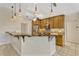 Kitchen with stainless steel appliances, custom cabinets, and a unique breakfast bar at 154 Academy Oaks Pl, Altamonte Springs, FL 32714
