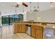 Kitchen with views of the pool, unique bar, and stainless steel appliances at 154 Academy Oaks Pl, Altamonte Springs, FL 32714
