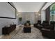 Staged living room featuring tile floors, a movie screen, seating, and wall art at 154 Academy Oaks Pl, Altamonte Springs, FL 32714
