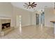 Spacious living room with brick fireplace, tile flooring, and unique wood accents at 154 Academy Oaks Pl, Altamonte Springs, FL 32714