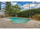 Screened pool area surrounded by lush greenery for privacy at 154 Academy Oaks Pl, Altamonte Springs, FL 32714