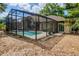 Inviting screened pool area with brick pavers and attached covered patio for relaxed outdoor living and entertaining at 154 Academy Oaks Pl, Altamonte Springs, FL 32714