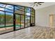 Sun room features floor-to-ceiling windows with views of the pool at 154 Academy Oaks Pl, Altamonte Springs, FL 32714