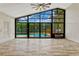 Bright sun room with floor-to-ceiling windows offering views of the pool and backyard at 154 Academy Oaks Pl, Altamonte Springs, FL 32714