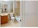 Bright bathroom featuring a tub and shower combination and a wooden vanity at 1558 Cumin Dr, Poinciana, FL 34759