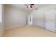 Bright and spacious bedroom featuring tile floors, ceiling fan and closet space at 1558 Cumin Dr, Poinciana, FL 34759