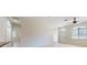 Bright living room with tile floors, ceiling fan and large windows for natural light at 1558 Cumin Dr, Poinciana, FL 34759
