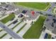 Aerial view of townhomes featuring solar panels and private driveways in a vibrant community at 1818 Katz Crossing Dr, Kissimmee, FL 34744