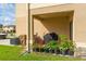 Cozy back porch, perfect for relaxing and enjoying the outdoors with convenient backyard access at 1818 Katz Crossing Dr, Kissimmee, FL 34744