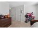Bedroom featuring carpet, furniture, and two doors at 1818 Katz Crossing Dr, Kissimmee, FL 34744