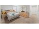 Bright bedroom with carpet flooring, a large dresser, and a comfortable bed at 1818 Katz Crossing Dr, Kissimmee, FL 34744