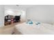 Spacious bedroom featuring neutral carpet, a comfortable bed, and a dedicated desk/work space at 1818 Katz Crossing Dr, Kissimmee, FL 34744