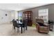 Open-concept dining room with tile floors, ample natural light, and comfortable seating at 1818 Katz Crossing Dr, Kissimmee, FL 34744