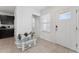 Bright entryway featuring neutral tile and decor, leading into the home at 1818 Katz Crossing Dr, Kissimmee, FL 34744