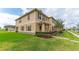 Charming townhome exterior with lush green lawn and inviting curb appeal at 1818 Katz Crossing Dr, Kissimmee, FL 34744