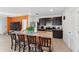 Modern kitchen island with seating, stainless steel appliances, and ample counter space at 1818 Katz Crossing Dr, Kissimmee, FL 34744