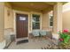 Inviting front porch with seating and decorative accents, perfect for relaxing at 1818 Katz Crossing Dr, Kissimmee, FL 34744