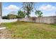 Fenced-in backyard featuring a grassy lawn and a tall wooden fence for privacy and seclusion at 1823 Ashton E Dr, St Cloud, FL 34771