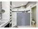 Modern bathroom with tiled walls, rainfall shower head, and built-in shelving at 1823 Ashton E Dr, St Cloud, FL 34771