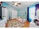 Bedroom featuring hardwood floors, cute decor, and lots of natural light at 1823 Ashton E Dr, St Cloud, FL 34771